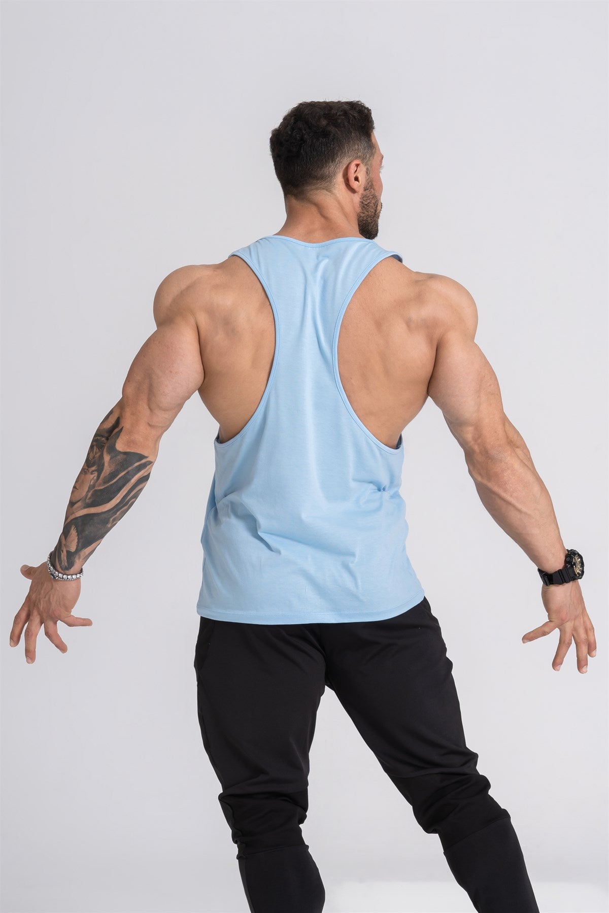 Gymwolves Man Sport Stringer | Light Blue | Workout Tanktop | Comfortable Series | - Shakeproteine